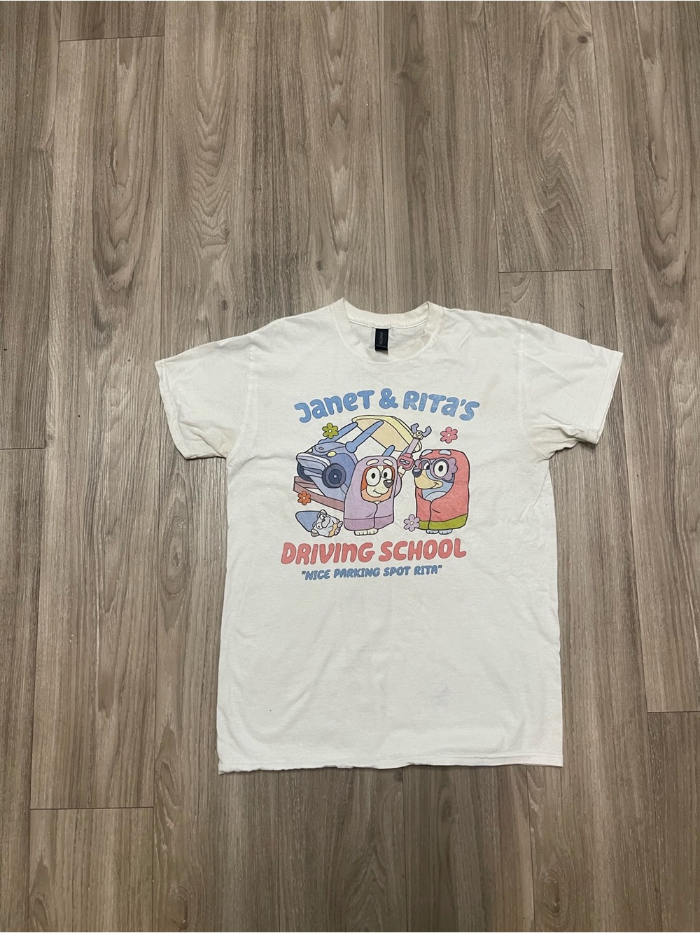 Janet & Rita Driving School (Bluey) Graphic Tee with Blue Pink and Yellow Print